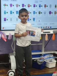 boy holding a sheet of paper